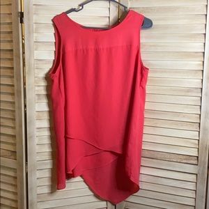 Coral sleeveless blouse.